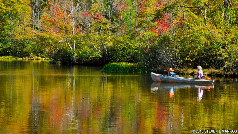 Canoeists explore small coves along Julian Price Lake on the Blue Ridge Parkway