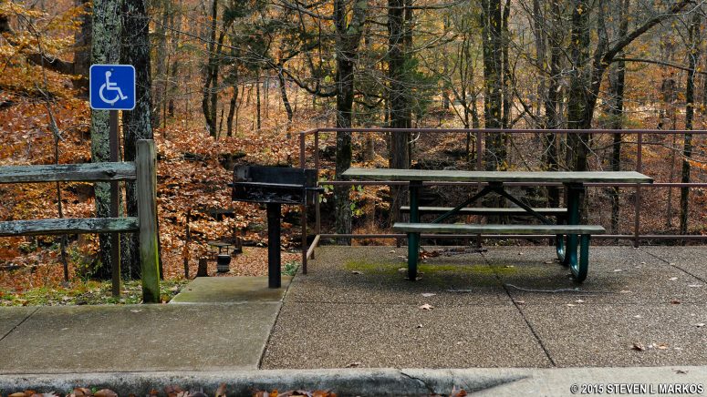 Handicap accessible table next to the parking lot