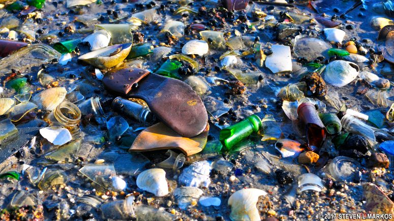 Shoe soles and glass at Bottle Beach near Floyd Bennett Field in Brooklyn, Gateway National Recreation Area