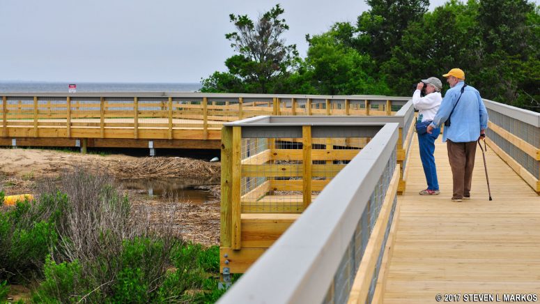 Bird watchers on the Spermaceti Cove Boardwalk in the Sandy Hook unit of Gateway National Recreation Area