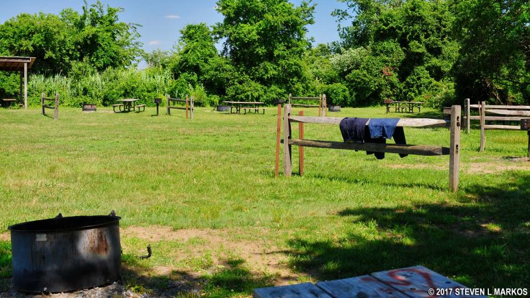 Campsites surround an open field at the Tamarack section of Camp Gateway Brooklyn, Gateway National Recreation Area