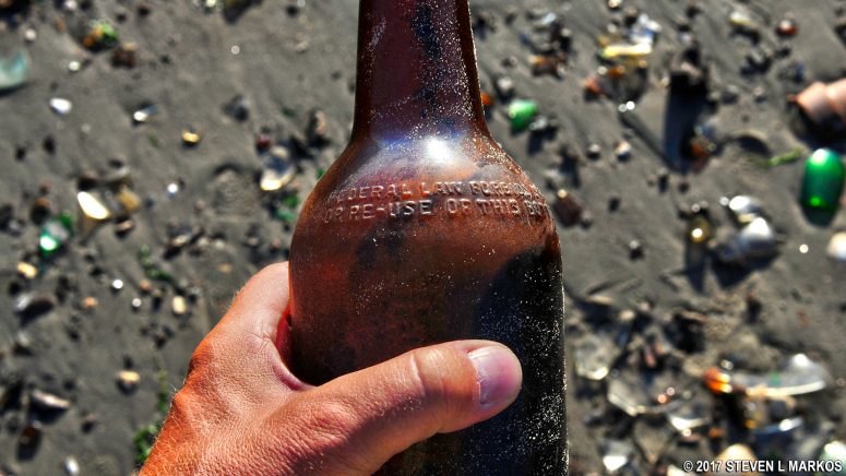 Bottle with a federal warning about reusing the bottle found on Bottle Beach, Gateway National Recreation Area