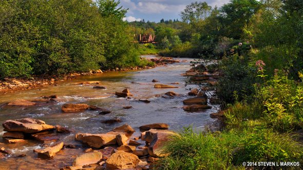 The Walk Through the Ruins Trail at Johnstown Flood National Memorial leads to the Little Conemaugh River