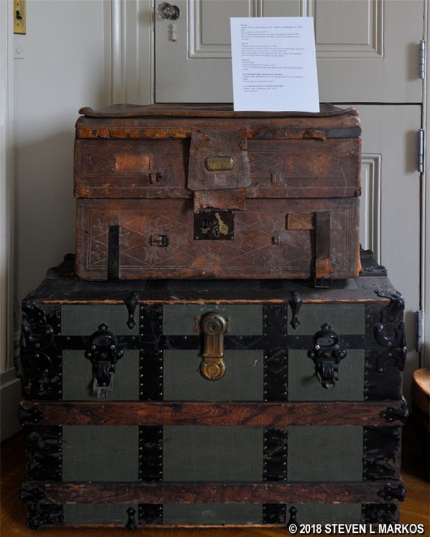 Antique trunks on display in the Rotch-Jones-Duff House with information about their histories