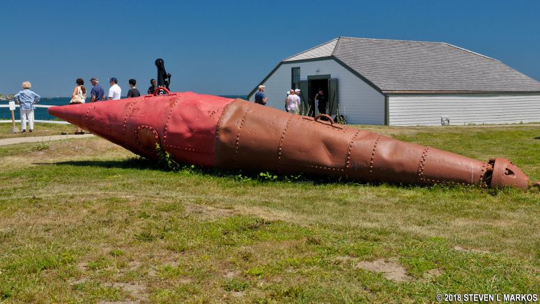 Red Nun Buoy from the 1920s with the Cistern Building in the background, Little Brewster Island, Boston Harbor Islands National Recreation Area