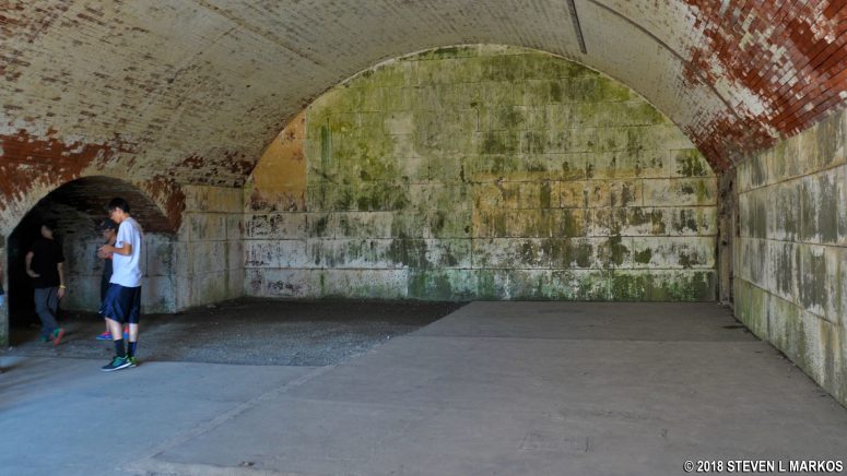 Visitors enter Fort Warren's Bastion A through the Dark Arch