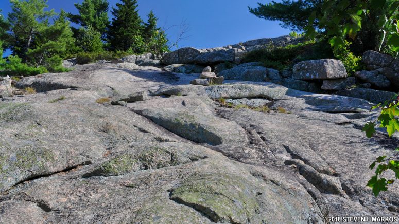 Steep granite slab on the upper section of the Bald Peak Trail at Acadia National Park