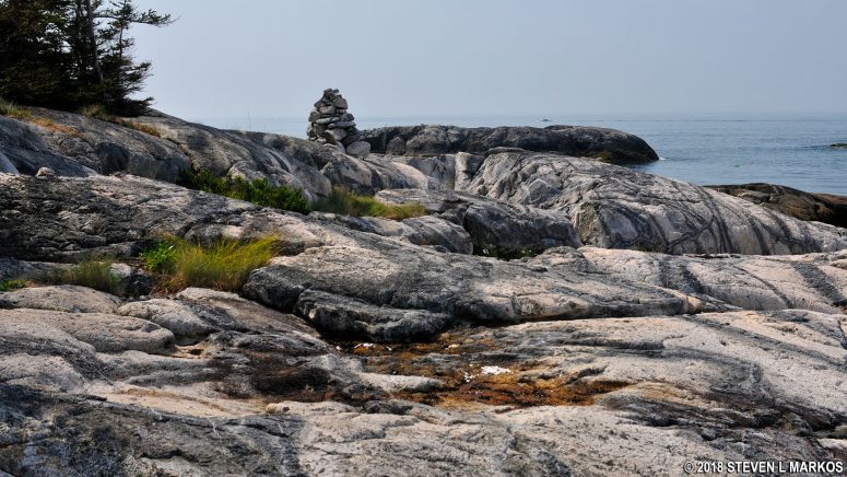 Cairn marks the route across the rocks on Isle au Haut's Western Head Trail in Acadia National Park