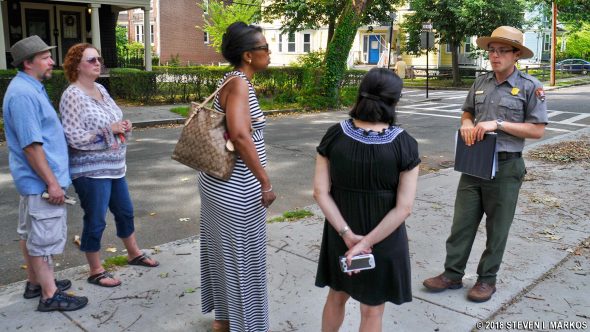 Ranger leads a walking tour to the Kennedy's Abbottsford Road house, John Fitzgerald Kennedy National Historic Site