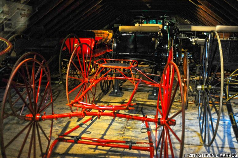Carriages on display inside the Wood Barn at Marsh-Billings-Rockefeller National Historical Park