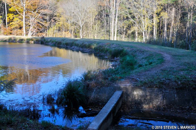 Retaining wall across the spillway of the lake near intersection JB 19 in the Jones Bridge Unit of Chattahoochee River National Recreation Area