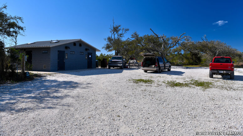 Restroom and parking area at the Fort Pickens Group Campsite at Gulf Islands National Seashore