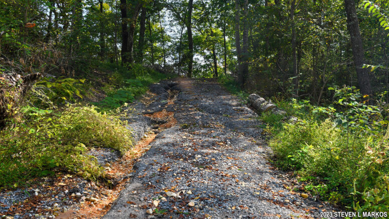 Visitors to Fort Heiman unit of Fort Donelson National Battlefield walk around the fort grounds on a washed-out road