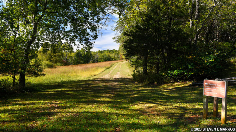 Sweeney Trail continues south from the gravel service road, Appomattox Court House National Historical Park