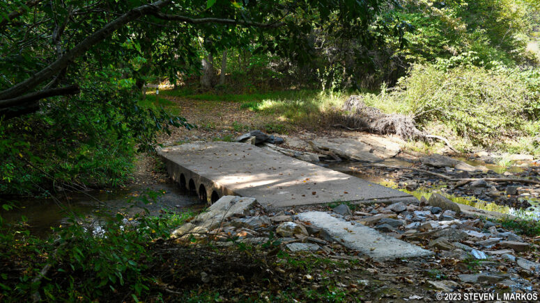 Southside Connector Trail crosses the Appomattox River via a cement footbridge, Appomattox Court House National Historical Park