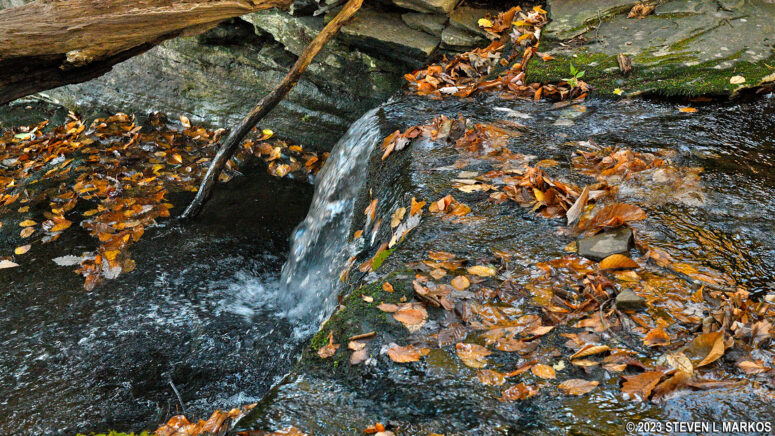 Stream crossed by the Bouchoux Trail forms a small cascade