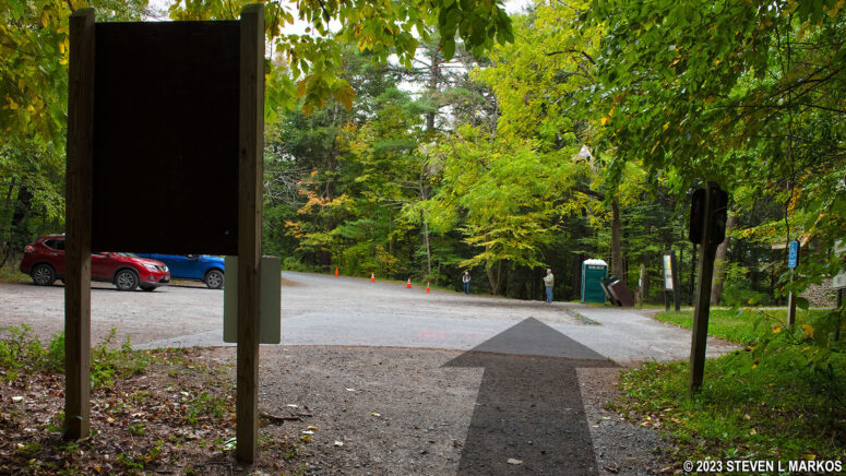 Cross the Raymondskill Falls parking lot to continue on the Raymondskill Falls Trail to the Hackers Trailhead parking lot, Delaware Water Gap National Recreation Area