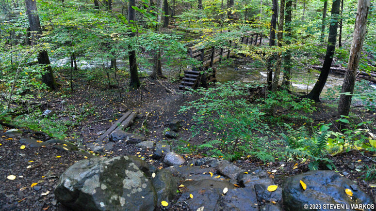 Stone stairs on the Lower Hornbecks Creek Trail lead down to a third bridge over the creek, Delaware Water Gap National Recreation Area