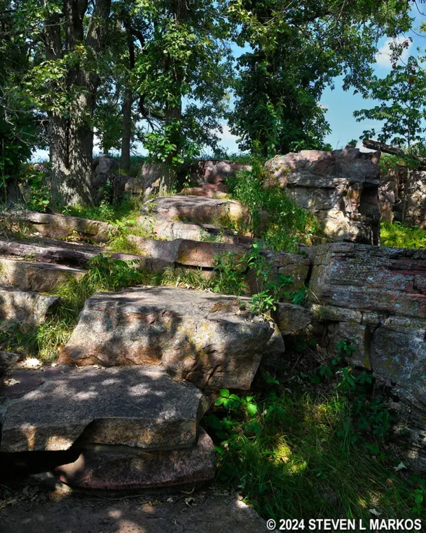 Stone slab steps lead down from the Nicollet Marker to the Circle Trail at Pipestone National Monument