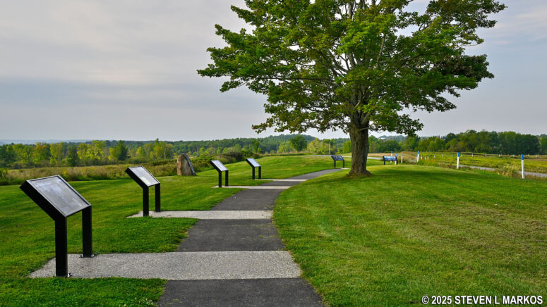 Paved path circles the Neilson Farm stop on the Saratoga Battlefield Tour, Saratoga National Historical Park