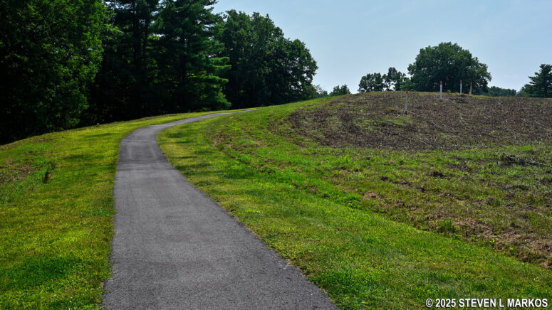 Paved path up a steep hill to the Breymann Redoubt at Stop 7 on the Saratoga Battlefield Tour, Saratoga National Historical Park