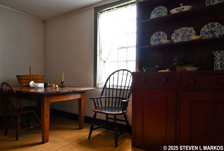 Table and china cabinet in the kitchen of the John Quincy Adams Birth Home, Adams National Historical Park