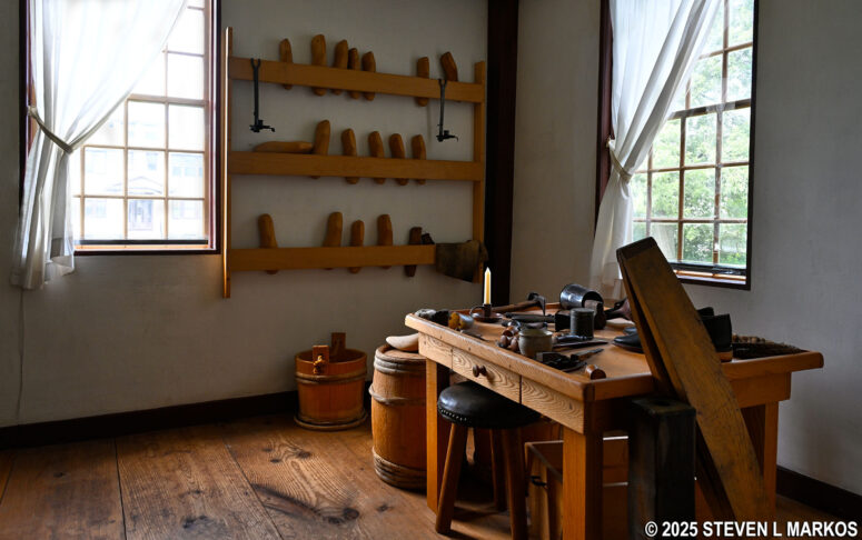Table and tools common in a cordwainer shop on display in the John Adams Birth Home, Adams National Historical Park
