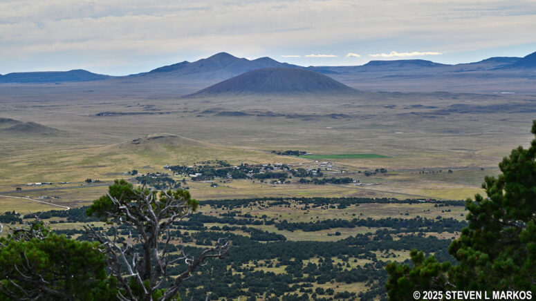Westward view of the Raton-Clayton Volcanic Field and the town of Capulin, New Mexico, from the crater rim of Capulin Volcano, Capulin Volcano National Monument