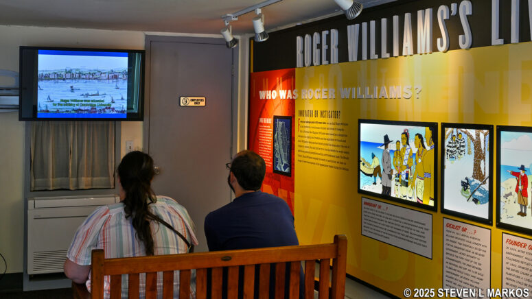 Visitors to Roger Williams National Memorial watch the park film in the Visitor Center