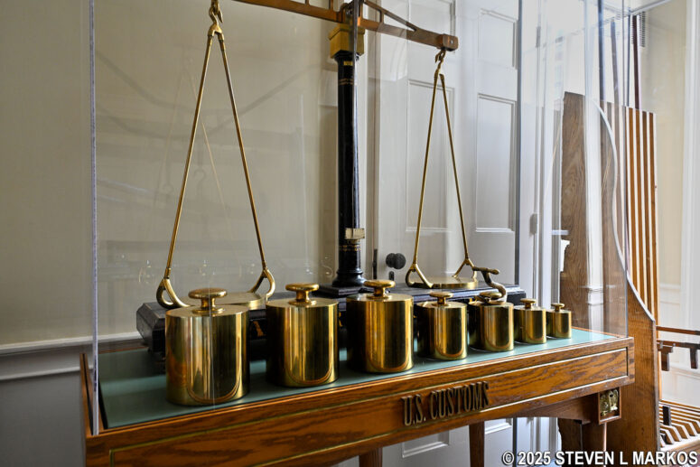 Weights and small scale used for weighing cargo on display in the U.S. Custom House, part of Salem Maritime National Historical Park