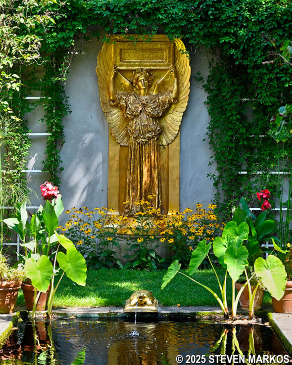 Augustus Saint-Gaudens' gilded relief sculpture Amor Caritas in the courtyard of the New Gallery and Picture Gallery at Saint-Gaudens National Historical Park
