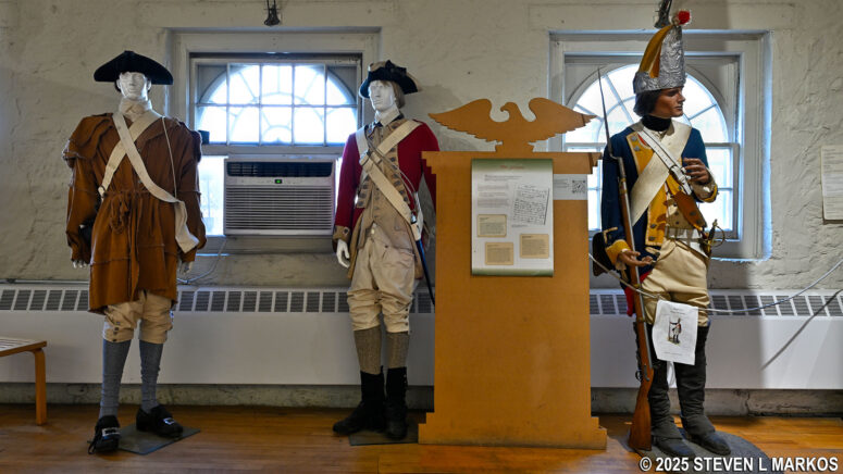 Display of military uniforms worn during the American Revolution on display at the Saint Paul's Church National Historic Site Visitor Center