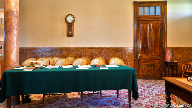 Original clock and water container inside the restored courtroom at the Fort Smith National Historic Site Visitor Center