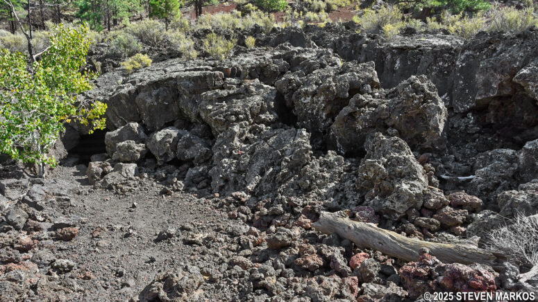 Caves visible due to a collapsed lava tube on the Lava Flow Trail, Sunset Crater Volcano National Monument