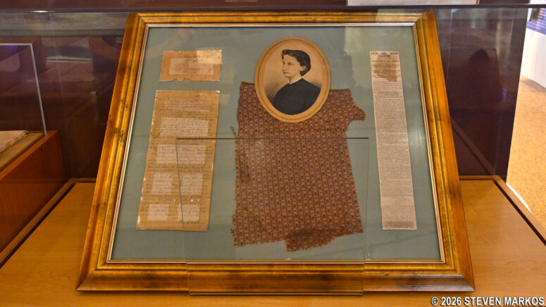 Dress fragment and letter from Clara Blinn on display at the Washita Battlefield National Historic Site Visitor Center