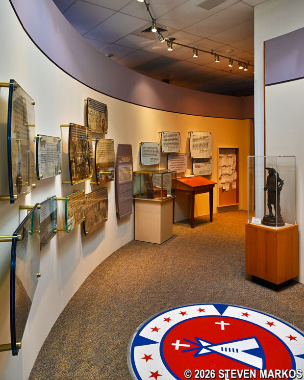 Exhibit area featuring quotes, Indian life after the battle, and a Native ceremonial cedar box at the Washita Battlefield National Historic Site Visitor Center