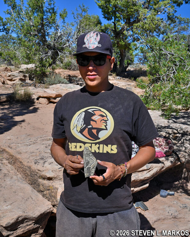 Navajo artist Alan Bíe shows his artwork at the Spider Rock Overlook, Canyon de Chelly National Monument