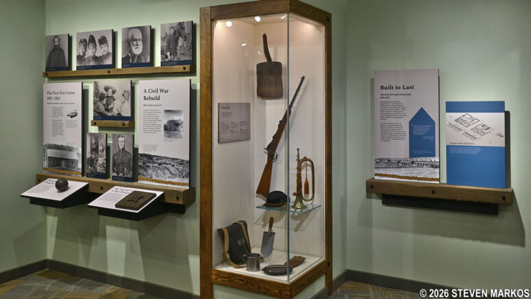 Exhibit on the three phases of Fort Union and a display of military items at the Fort Union National Monument Visitor Center