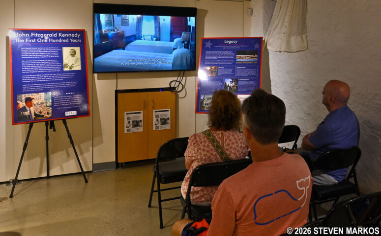 Visitors to the Kennedy House on Beals Street watch the park film in the Visitor Center, John Fitzgerald Kennedy National Historic Site