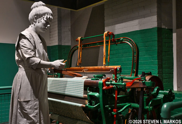 A Mill Girl operates a loom at Boott Cotton Mills Museum