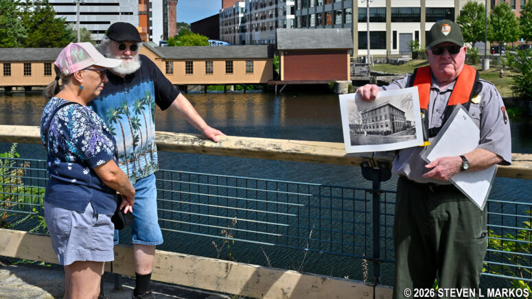 Ranger gives a talk on the history of the Pawtucket Canal near the Swamp Locks Dam Gatehouse, Lowell National Historical Park