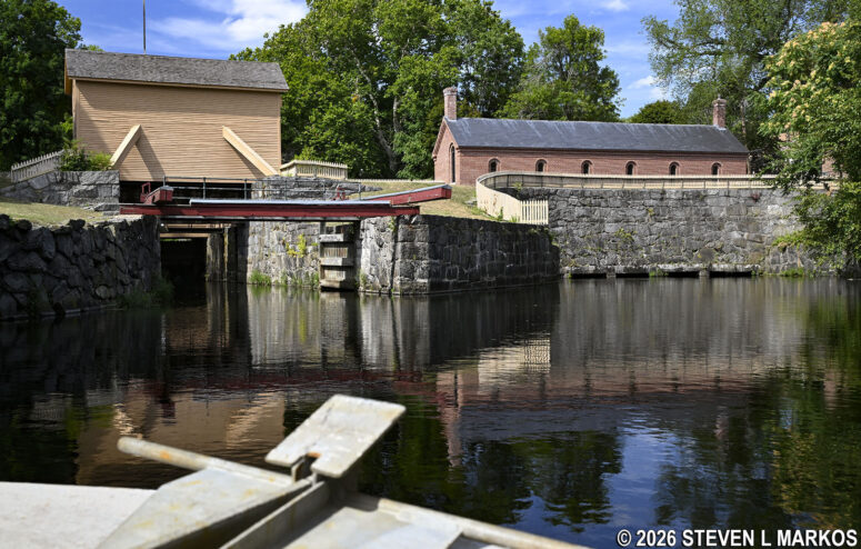 Pawtucket Canal Tour boat approaches the Francis Gate (left) and Gatehouse (right) in Lowell, Massachusetts