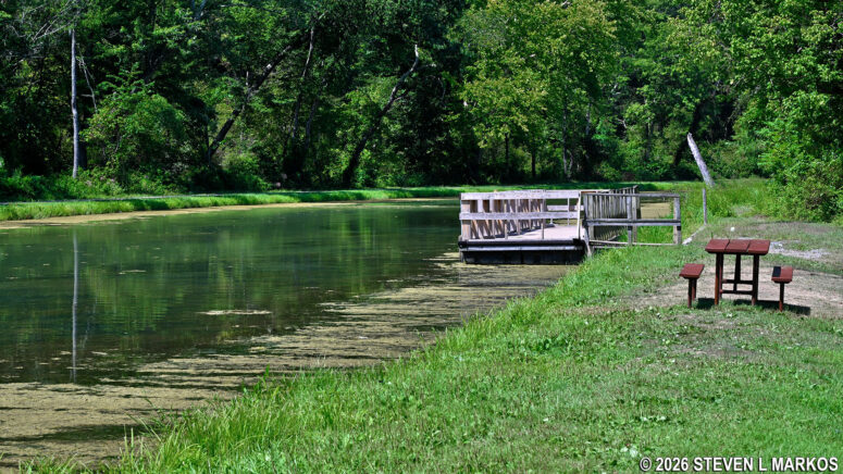Picnic table along the bank of the wide basin at Lock 70 on the Chesapeake and Ohio Canal