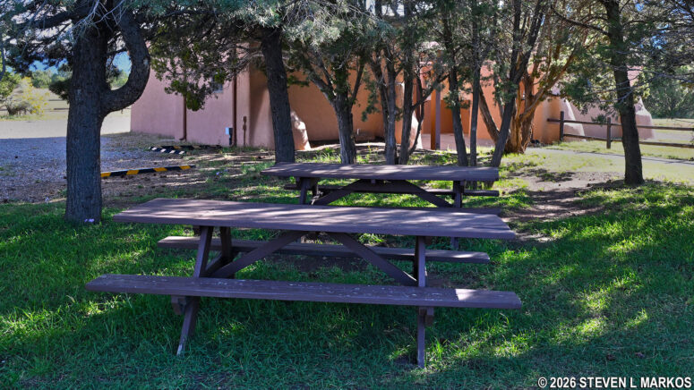 Picnic tables under the shade trees at the Spanish Mission Church parking lot, Pecos National Historical Park