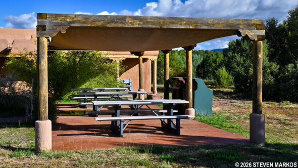 Accessible picnic tables under the shade shelter at the Pecos National Historical Park Visitor Center