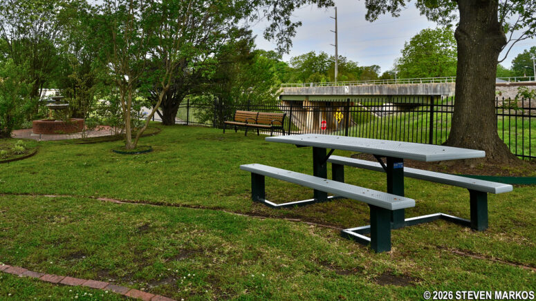 Picnic table under shade trees at President William Jefferson Clinton Birthplace Home National Historic Site