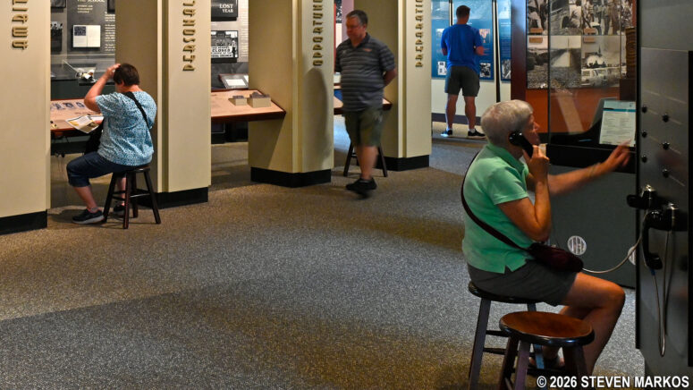 Visitor at the Little Rock Central High School Visitor Center listens to oral histories given by witnesses to the events that took place at the high school in 1957, Little Rock Central High School National Historic Site
